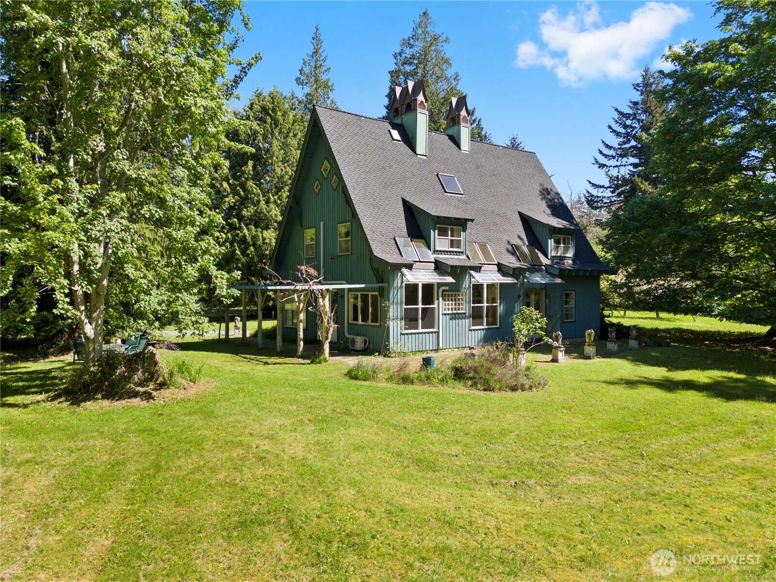 5513 Homestead Lane Anacortes, WA 98221 - Photo 36 of 37 a view of a house with a yard