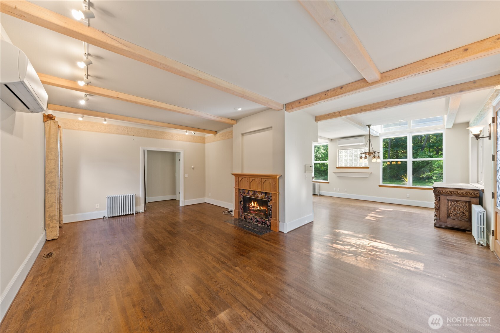 5513 Homestead Lane Anacortes, WA 98221 - Photo 5 of 37 a view of empty room with wooden floor and fireplace