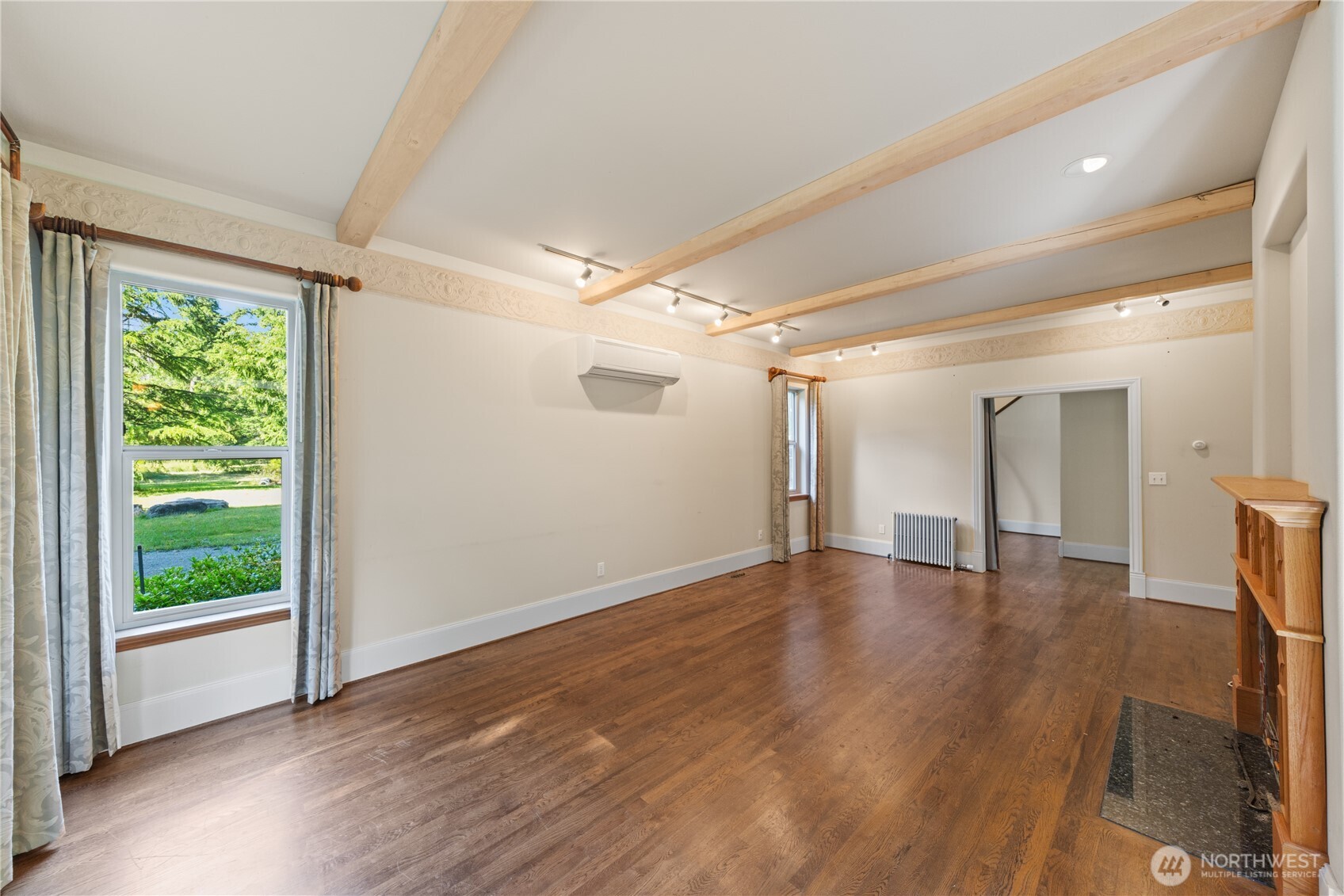5513 Homestead Lane Anacortes, WA 98221 - Photo 8 of 37 a view of empty room with wooden floor and fan