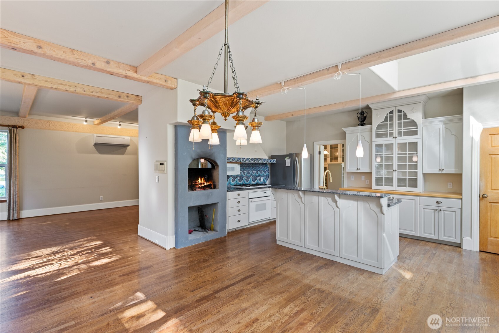 5513 Homestead Lane Anacortes, WA 98221 - Photo 10 of 37 a open kitchen with a refrigerator a stove top oven a sink and dishwasher a refrigerator with wooden floor