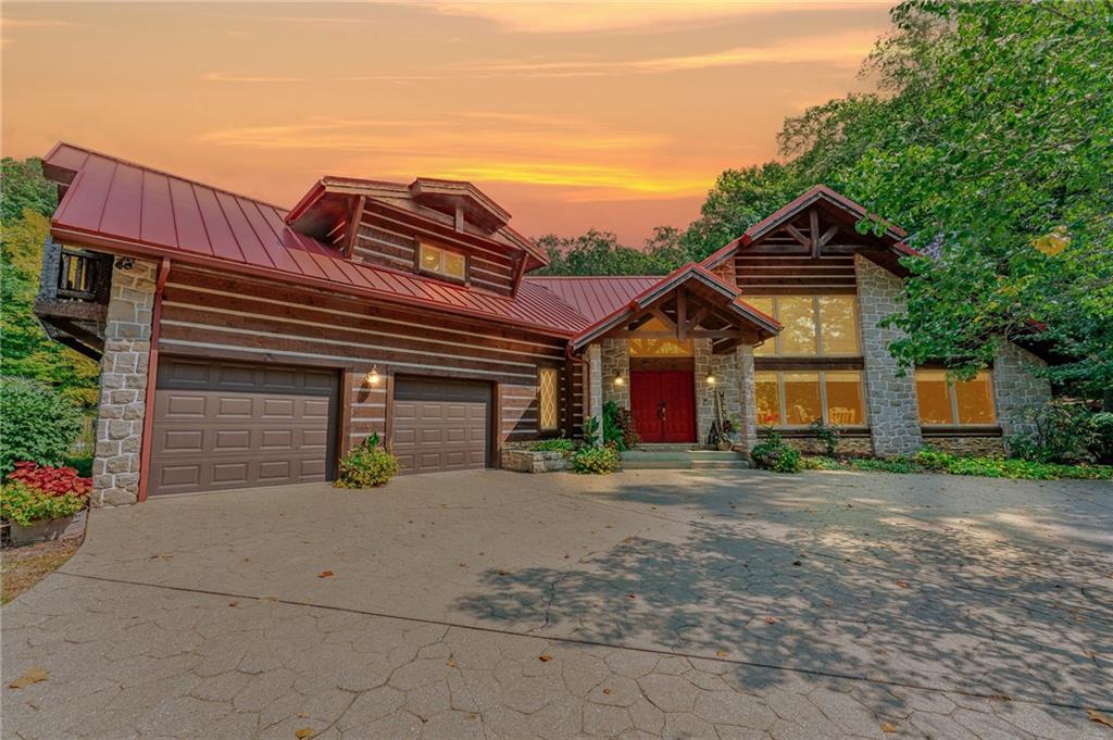 2162 Garards Fort Road Waynesburg, PA 15370 - Photo 1 of 50 a front view of a house with a yard and garage