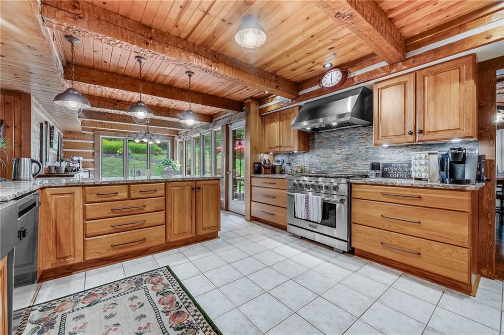2162 Garards Fort Road Waynesburg, PA 15370 - Photo 23 of 50 a kitchen with stainless steel appliances kitchen island granite countertop a sink and cabinets