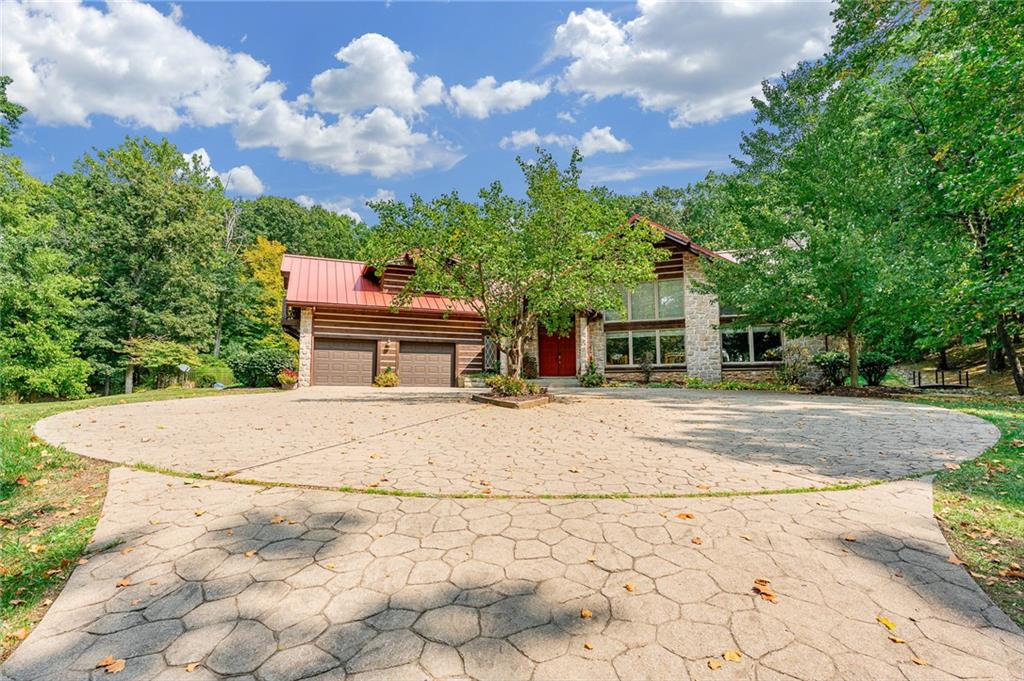 2162 Garards Fort Road Waynesburg, PA 15370 - Photo 36 of 50 a front view of a house with a yard and trees