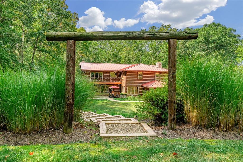 2162 Garards Fort Road Waynesburg, PA 15370 - Photo 43 of 50 a view of a yard with plants and a garden view