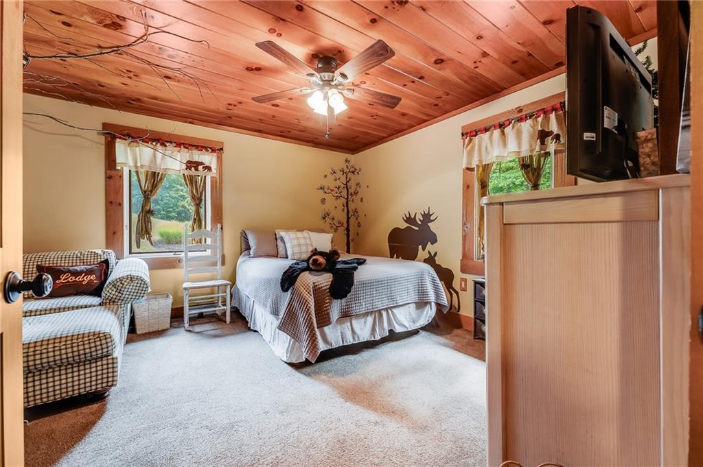 2162 Garards Fort Road Waynesburg, PA 15370 - Photo 9 of 50 a living room with furniture and a chandelier