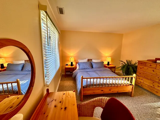 a bathroom with a sink mirror vanity and toilet