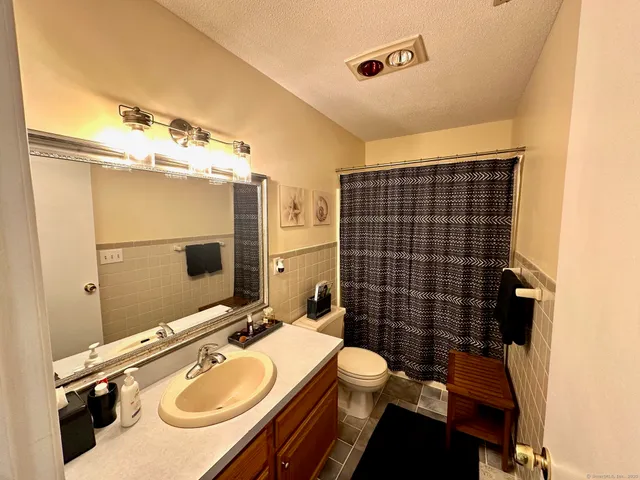 a utility room with sink dryer and washer