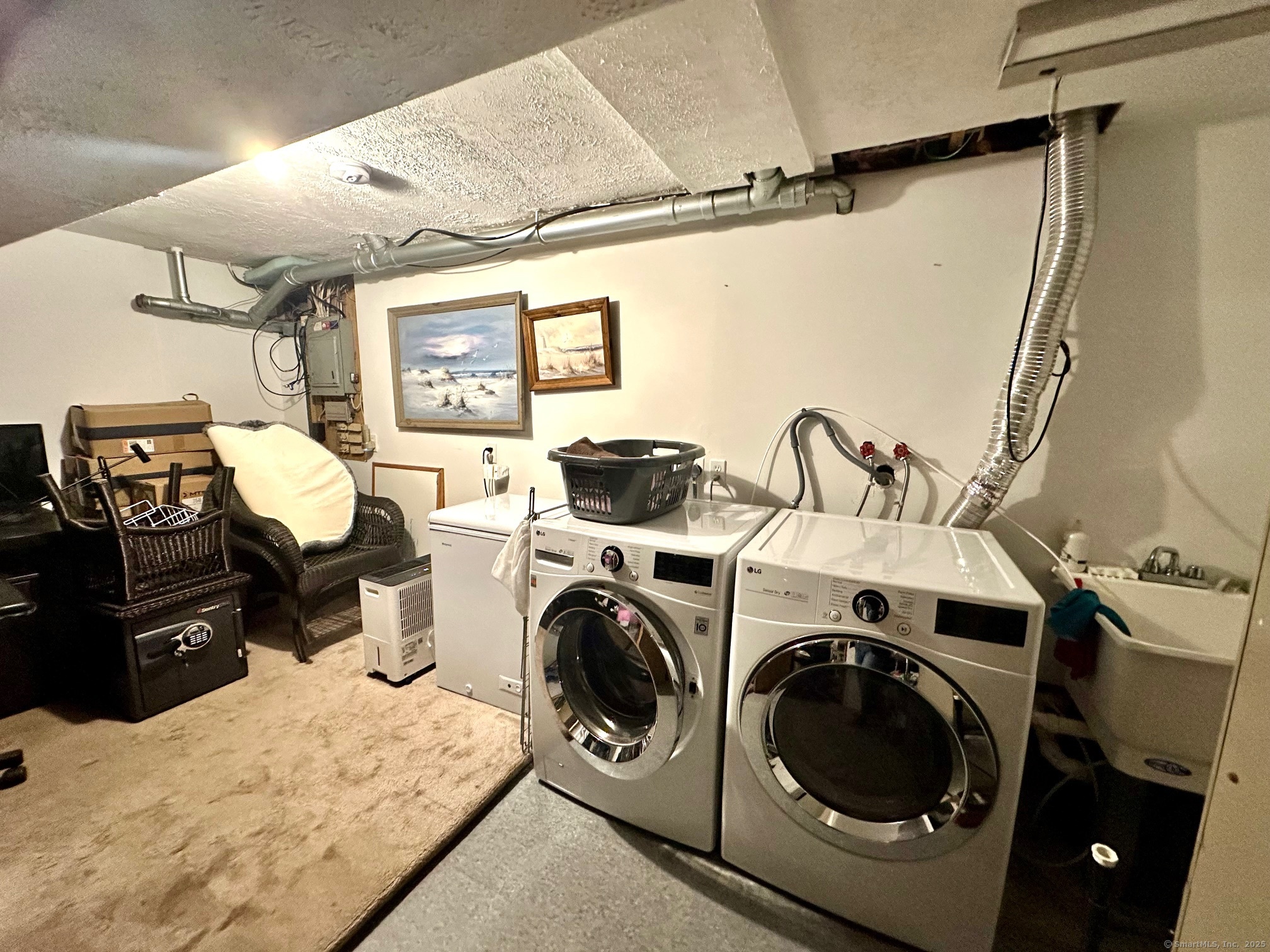 489 Wolcott Street, Unit 25 Bristol, CT 06010 - Photo 13 of 14 a utility room with sink dryer and washer