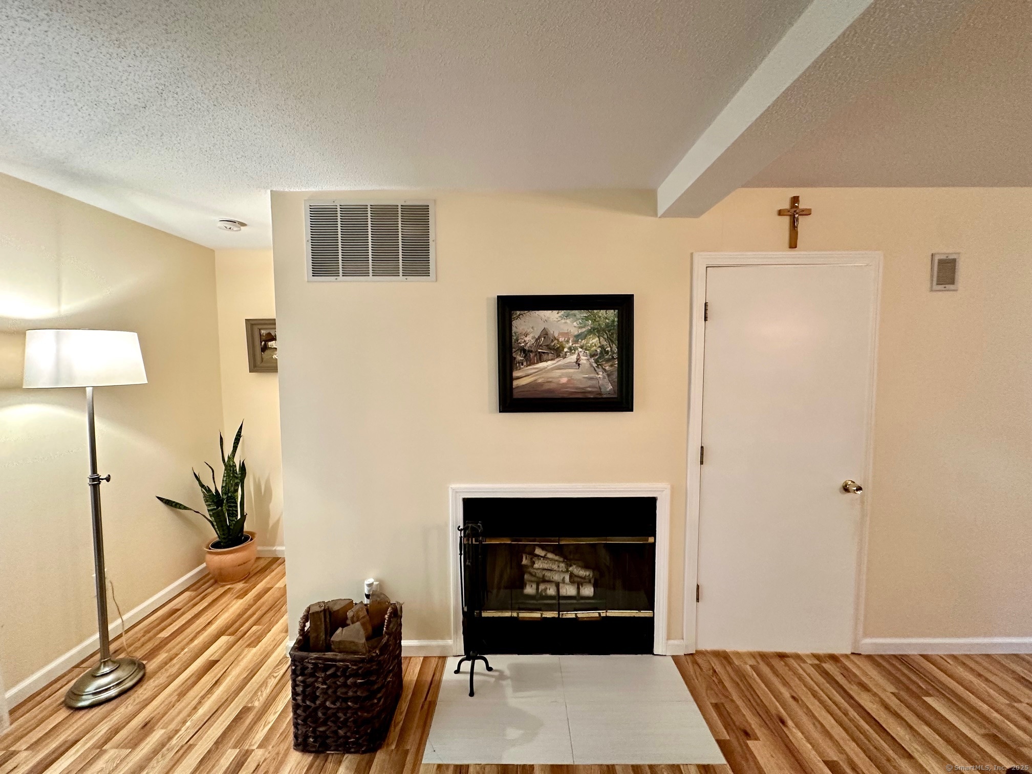 489 Wolcott Street, Unit 25 Bristol, CT 06010 - Photo 5 of 14 a living room with furniture and a fireplace