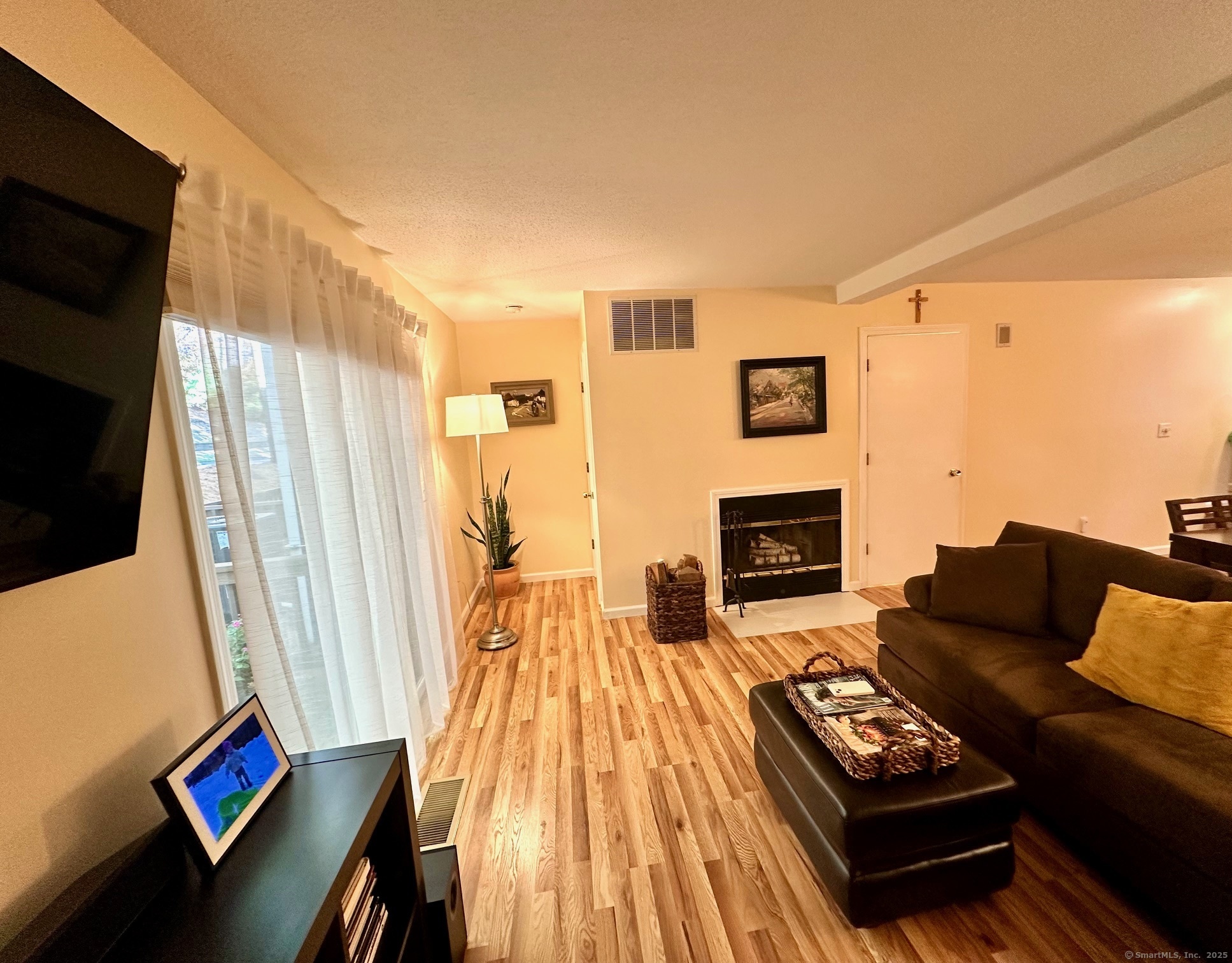489 Wolcott Street, Unit 25 Bristol, CT 06010 - Photo 6 of 14 a living room with furniture and a fireplace