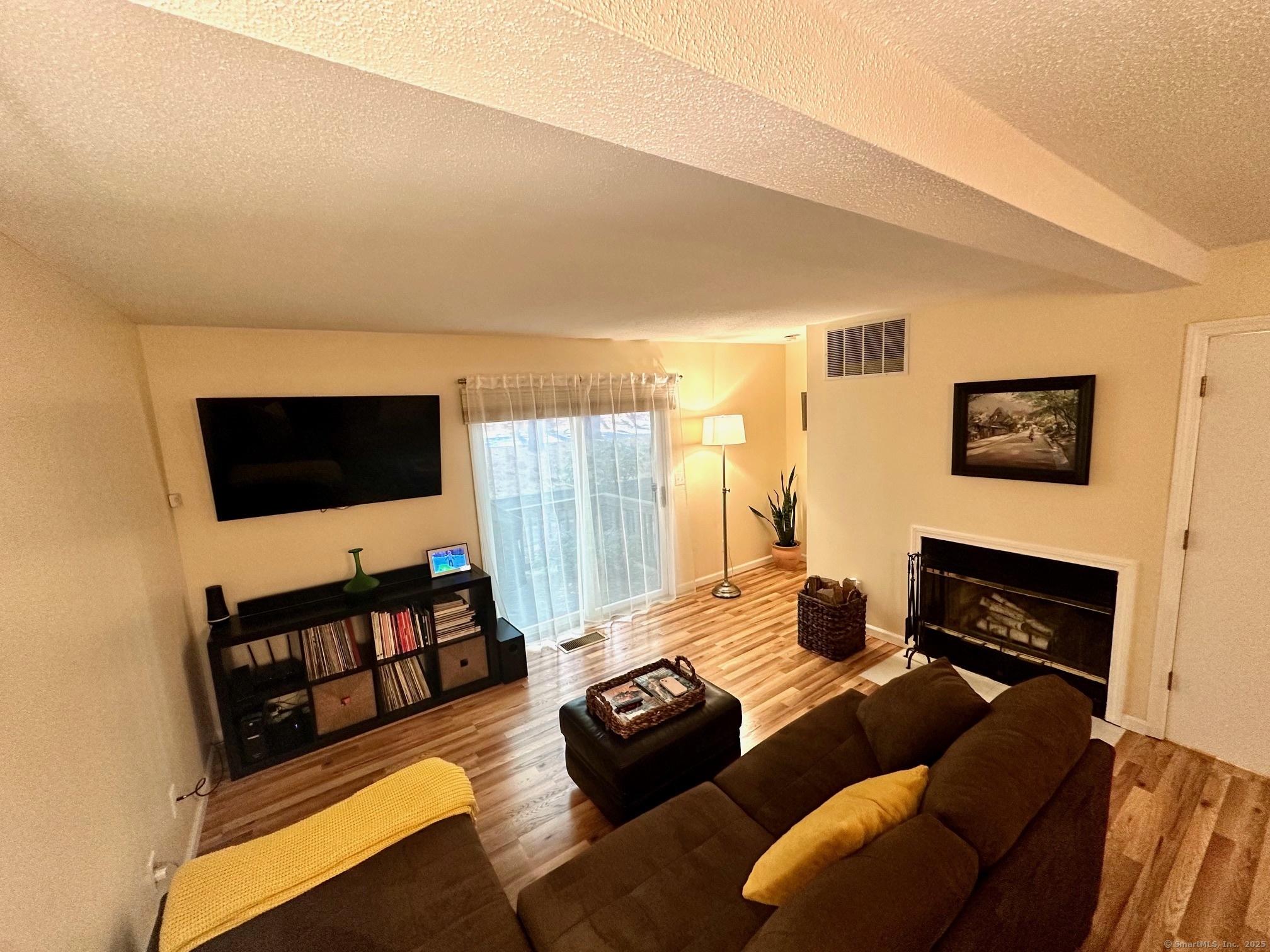 489 Wolcott Street, Unit 25 Bristol, CT 06010 - Photo 7 of 14 a living room with furniture and a flat screen tv