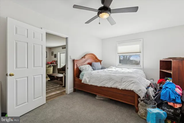 a view of walk in closet with clothes