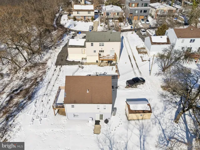 a view of a house with snow in the background