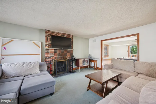 a bathroom with a sink a toilet and shower curtain