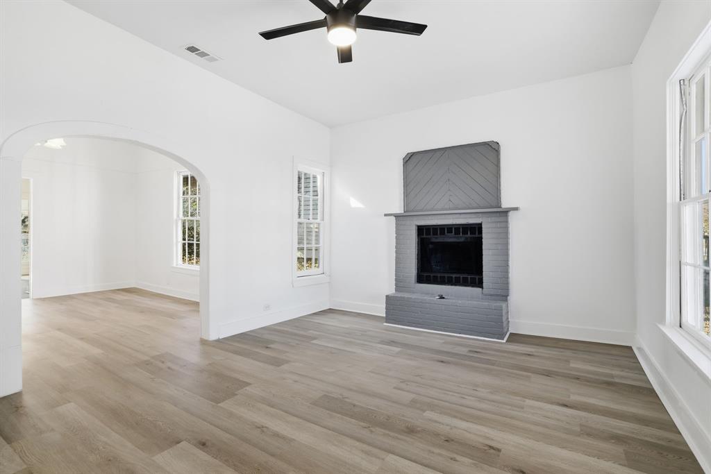 604 East Morton Street Denison, TX 75021 - Photo 3 of 22 wooden floor in an empty room with a window