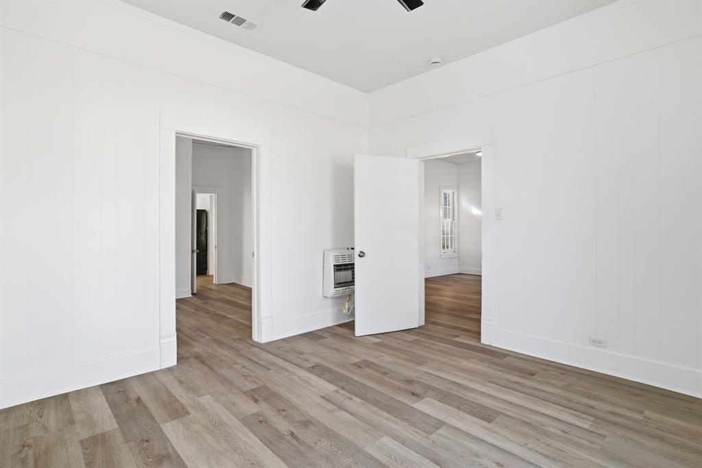 604 East Morton Street Denison, TX 75021 - Photo 6 of 22 a view of an empty room with wooden floor and closet