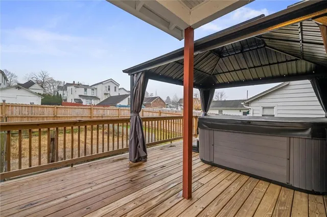 a view of a balcony with wooden floor