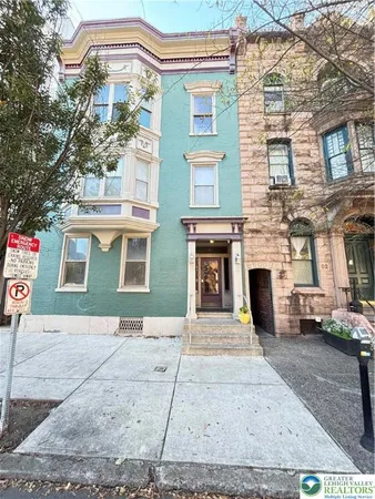 a front view of a house with yard