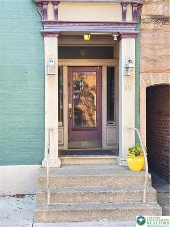 a front view of a house with a outdoor space