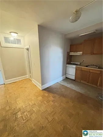 a view of a kitchen with a sink and a stove