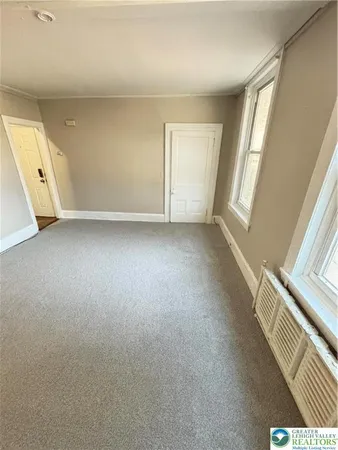 an empty room with windows