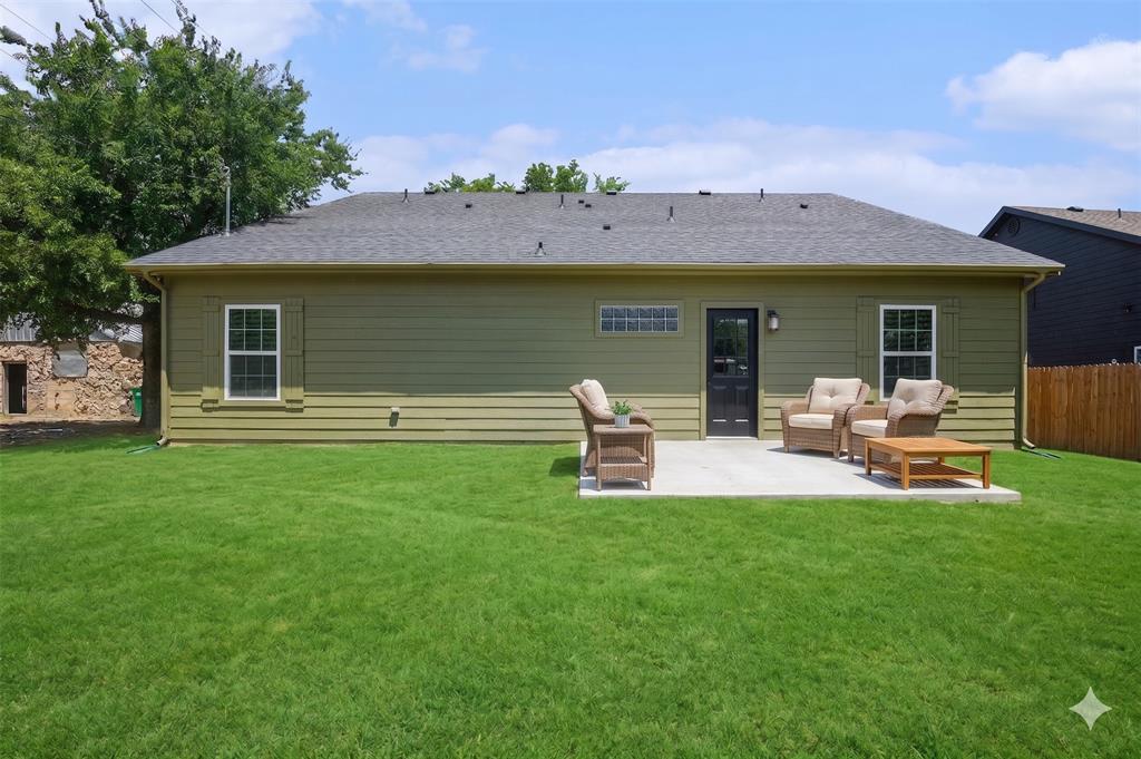 290 Aurora Street Rhome, TX 76078 - Photo 11 of 11 a view of a house with backyard porch and patio