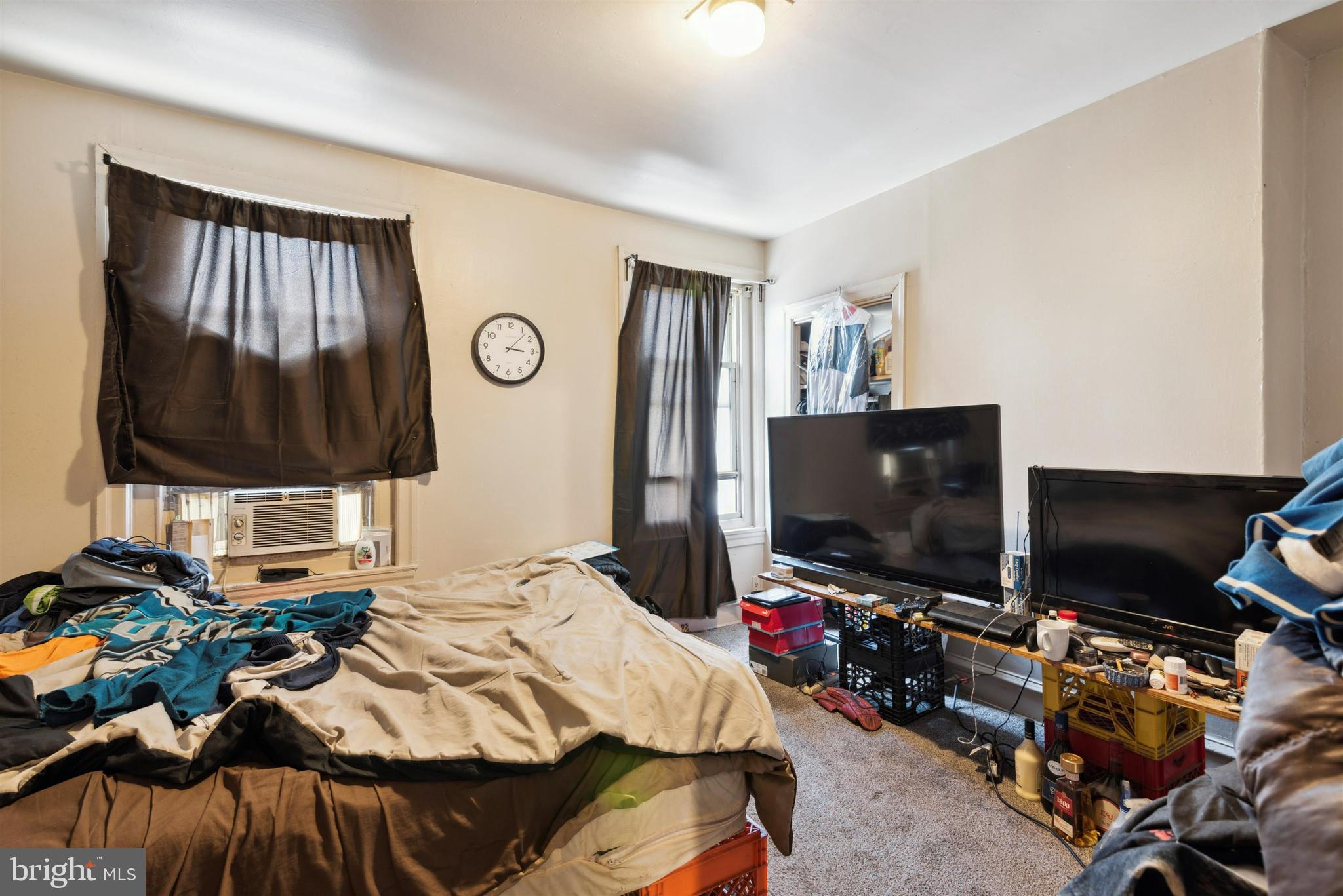 6124 Upland Street Philadelphia, PA 19142 - Photo 13 of 15 a bedroom with a bed and a flat screen tv