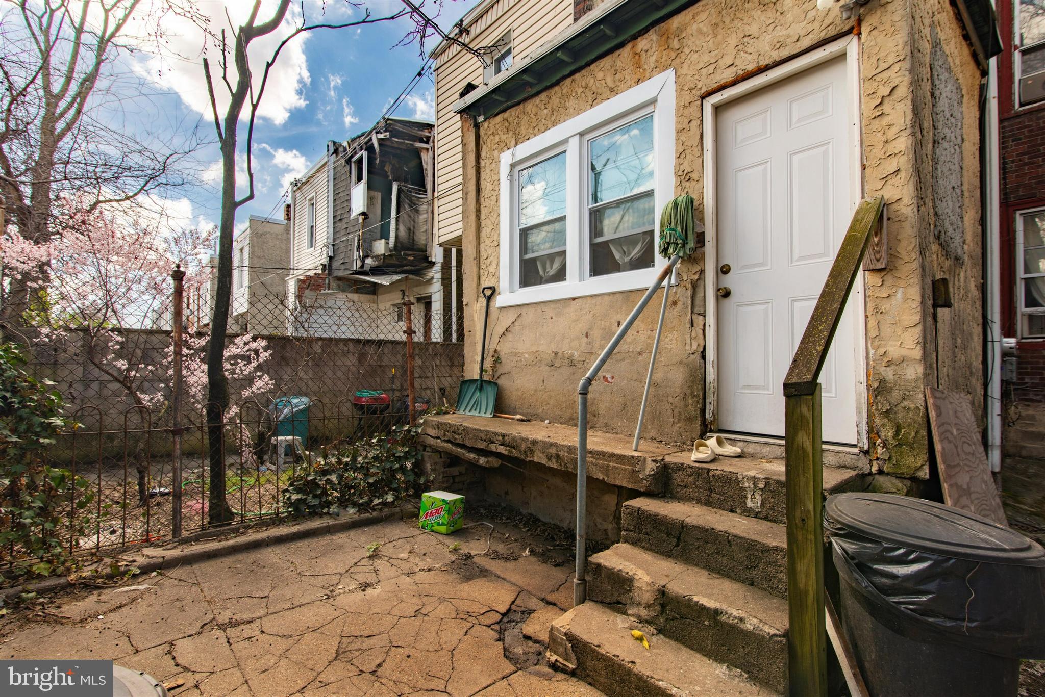 6124 Upland Street Philadelphia, PA 19142 - Photo 15 of 15 a view of a house with a wooden fence