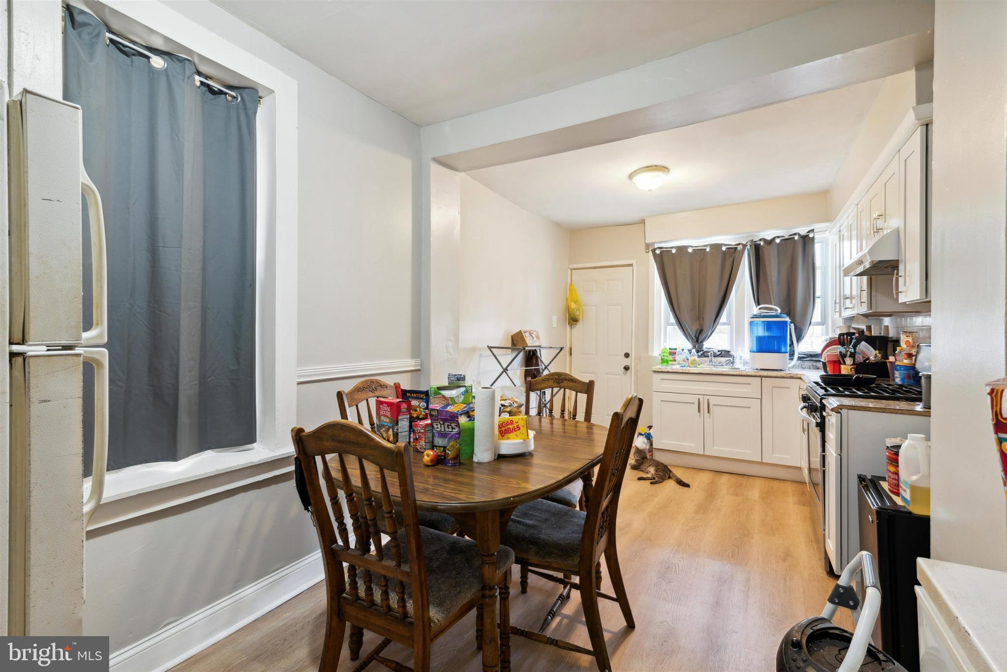 6124 Upland Street Philadelphia, PA 19142 - Photo 5 of 15 a view of a dining room with furniture and a window