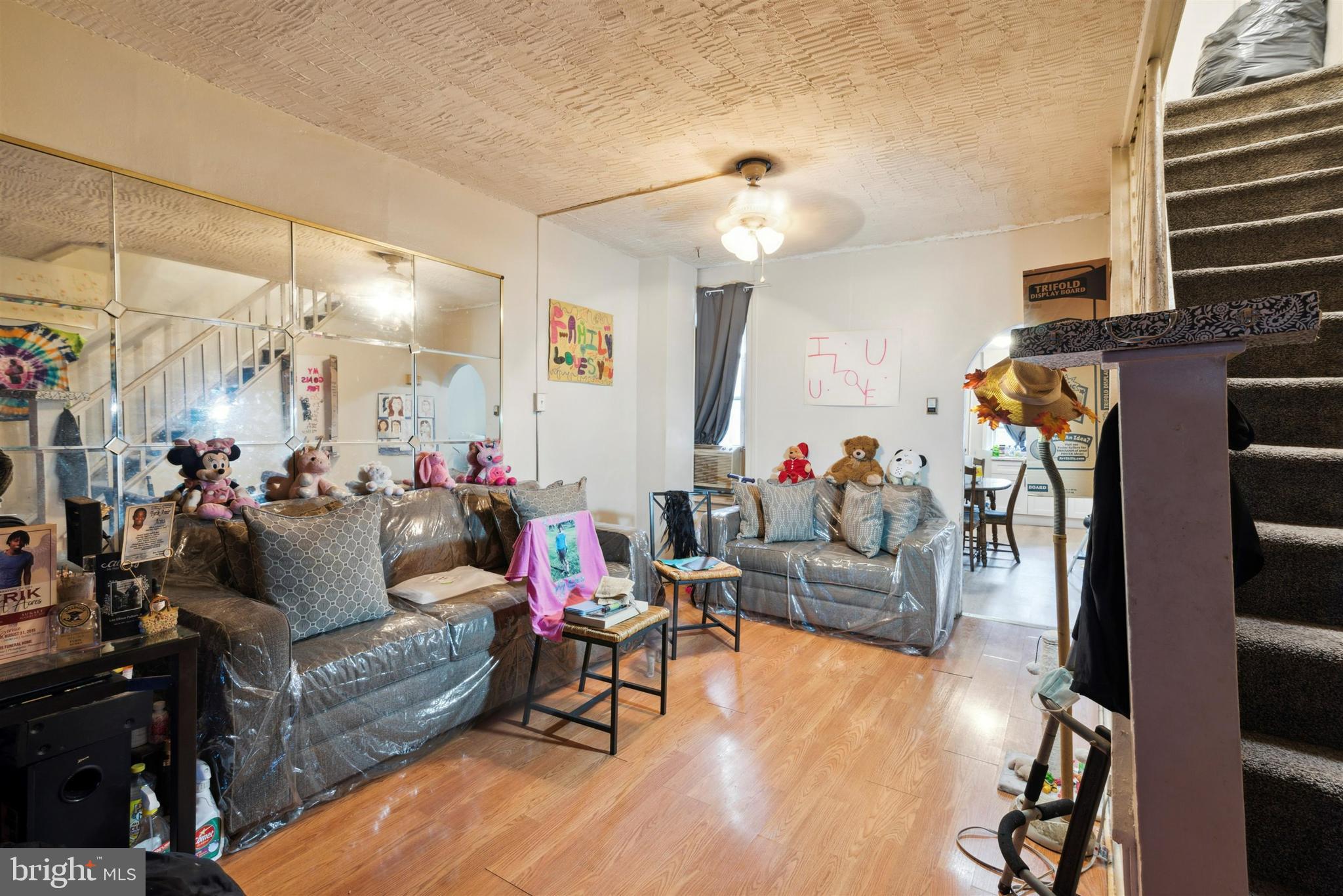 6124 Upland Street Philadelphia, PA 19142 - Photo 7 of 15 a living room with furniture and a flat screen tv