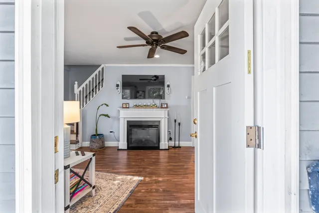 a view of an entryway and livingroom