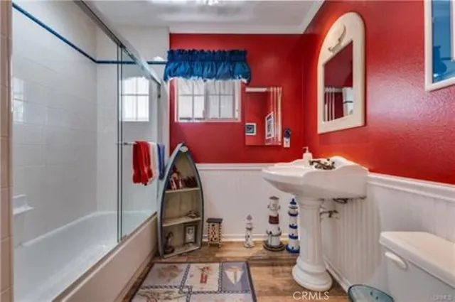a spacious bathroom with a double vanity sink and a mirror