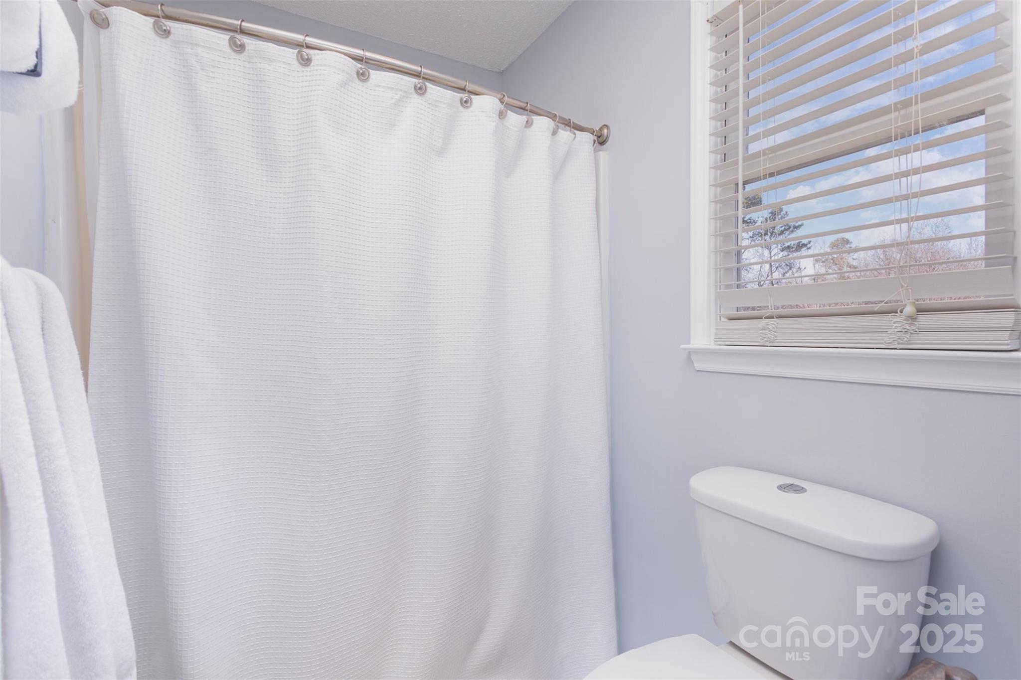 110 Weeping Willow Way Gastonia, NC 28052 - Photo 19 of 28 a bathroom with a toilet and a window