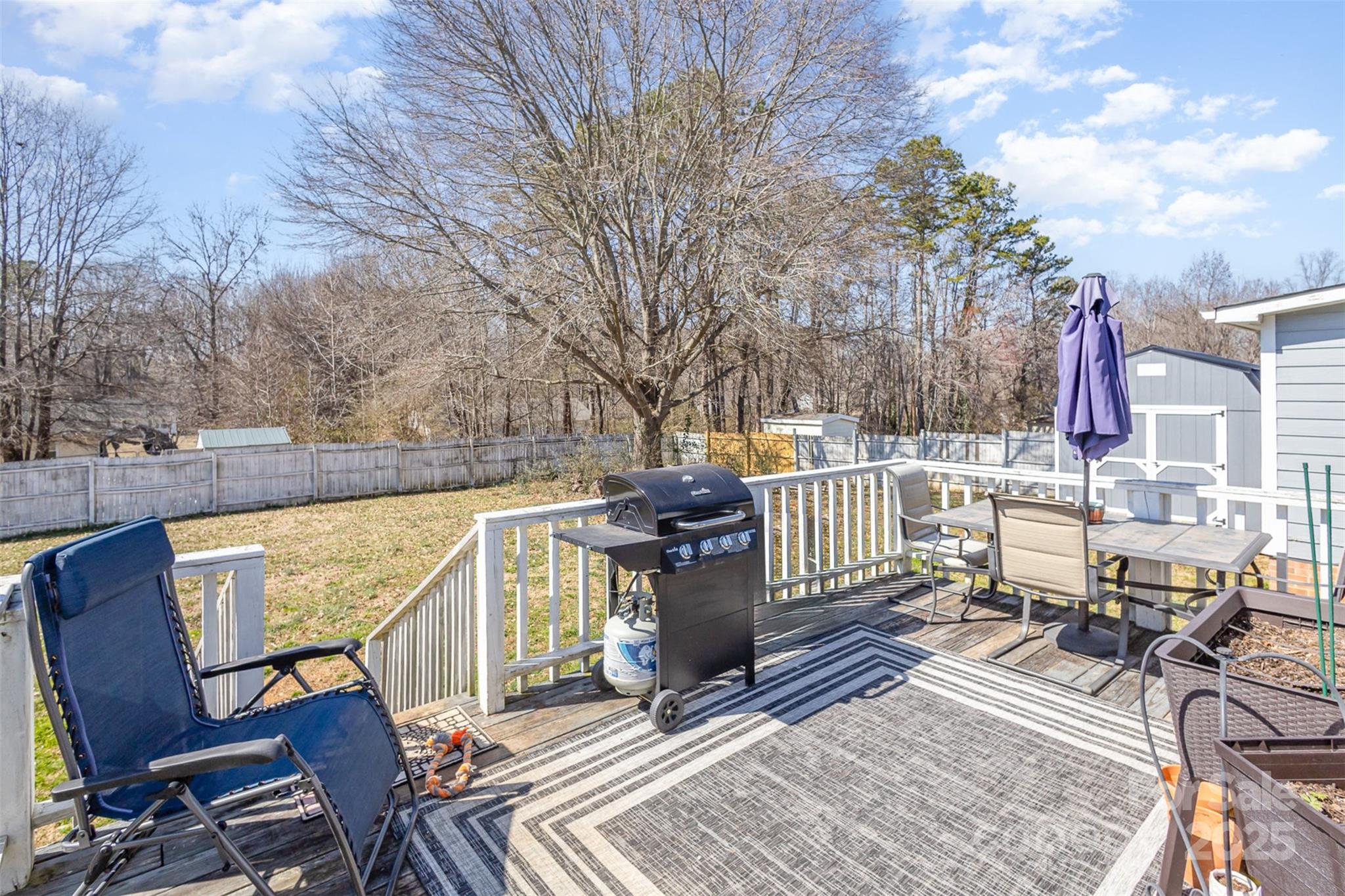 110 Weeping Willow Way Gastonia, NC 28052 - Photo 24 of 28 a view of a patio with table and chairs and wooden floor
