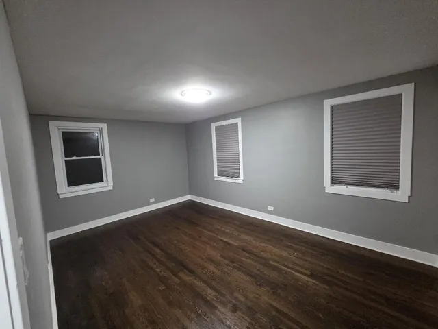 a view of a hallway and wooden floor