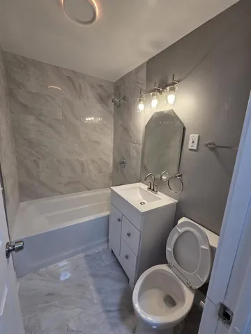 a large kitchen with a stove a sink and a refrigerator