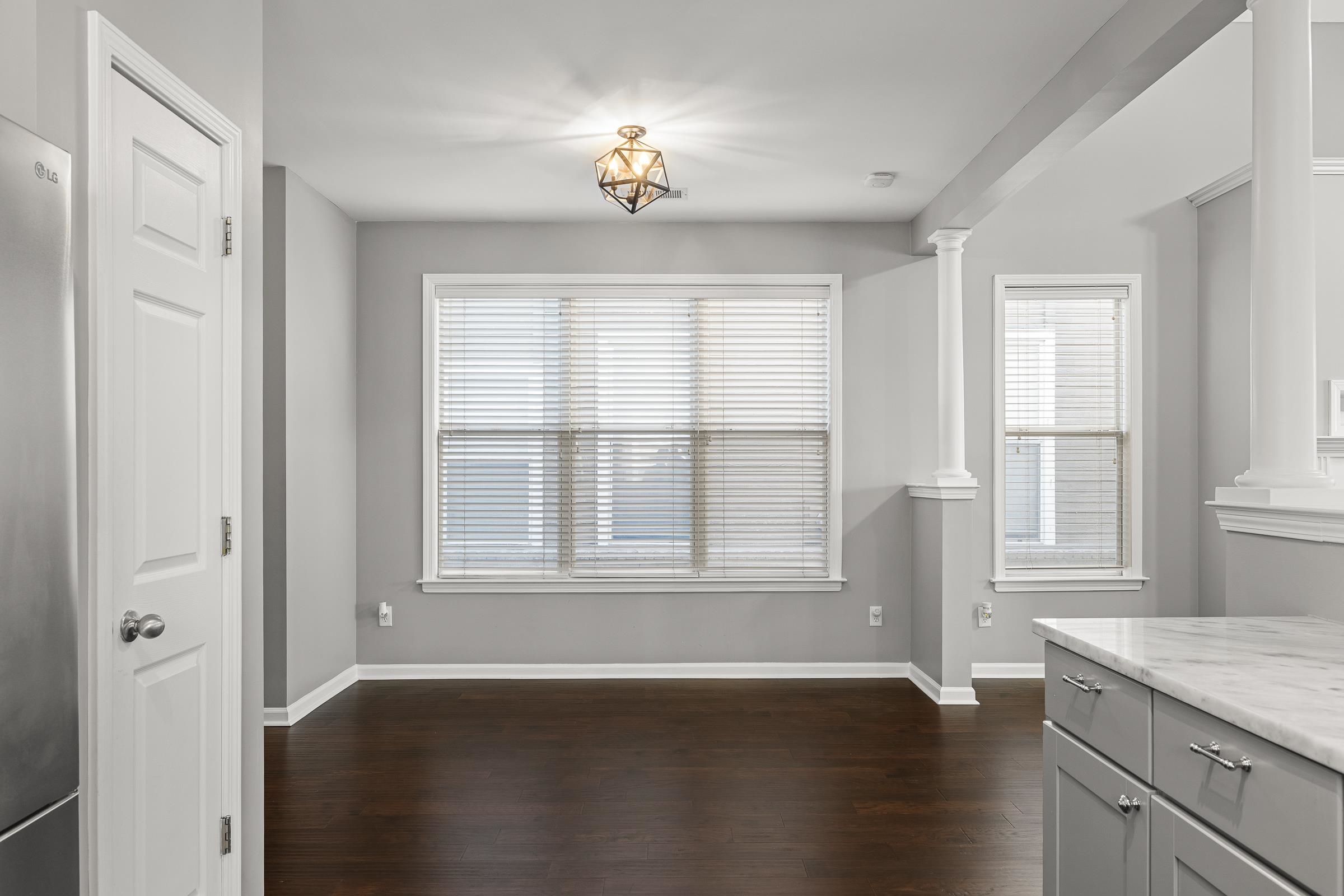 1323 Island Ridge Drive Memphis, TN 38103 - Photo 13 of 29 an empty room with wooden floor and windows