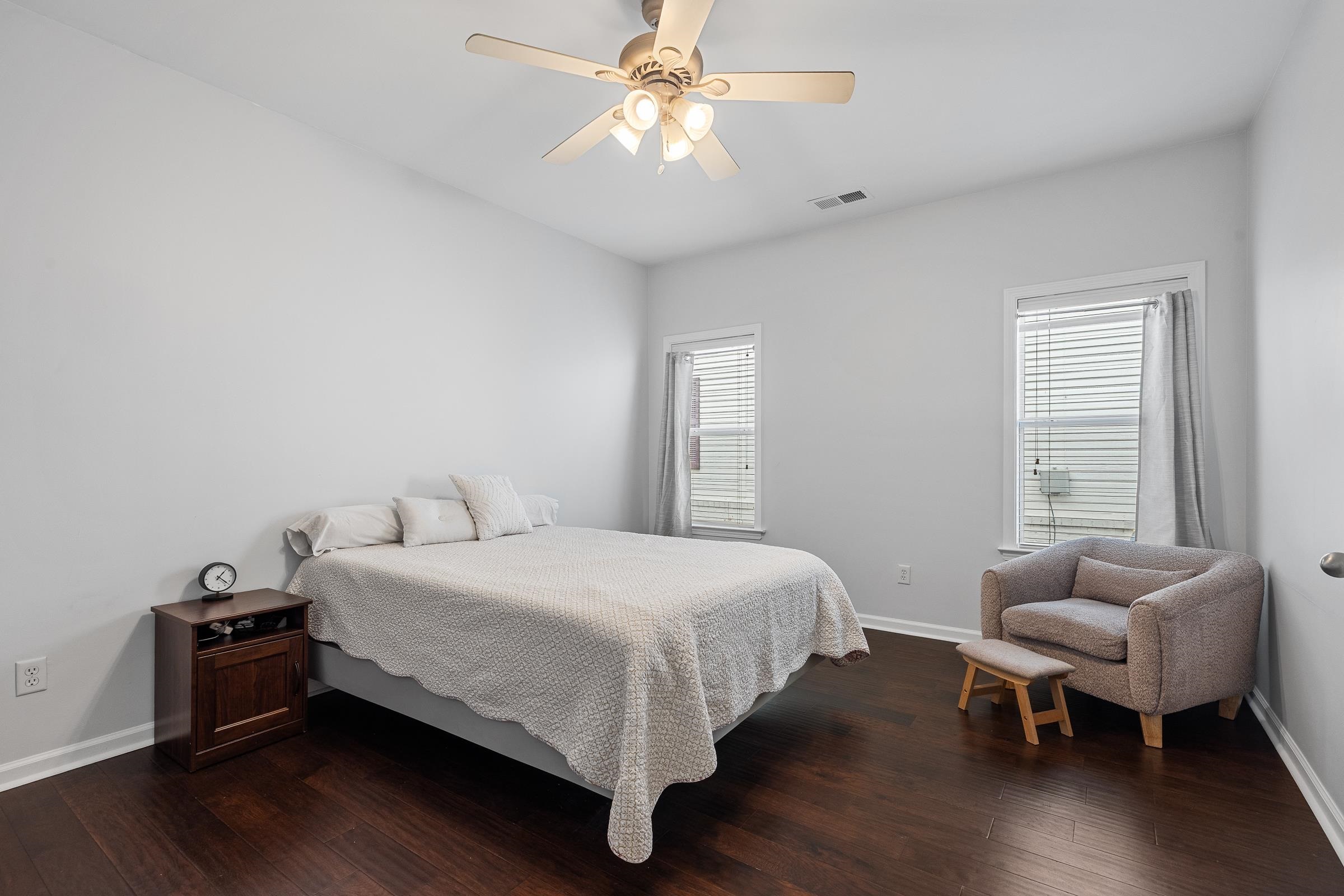 1323 Island Ridge Drive Memphis, TN 38103 - Photo 16 of 29 a bedroom with a bed and a chandelier