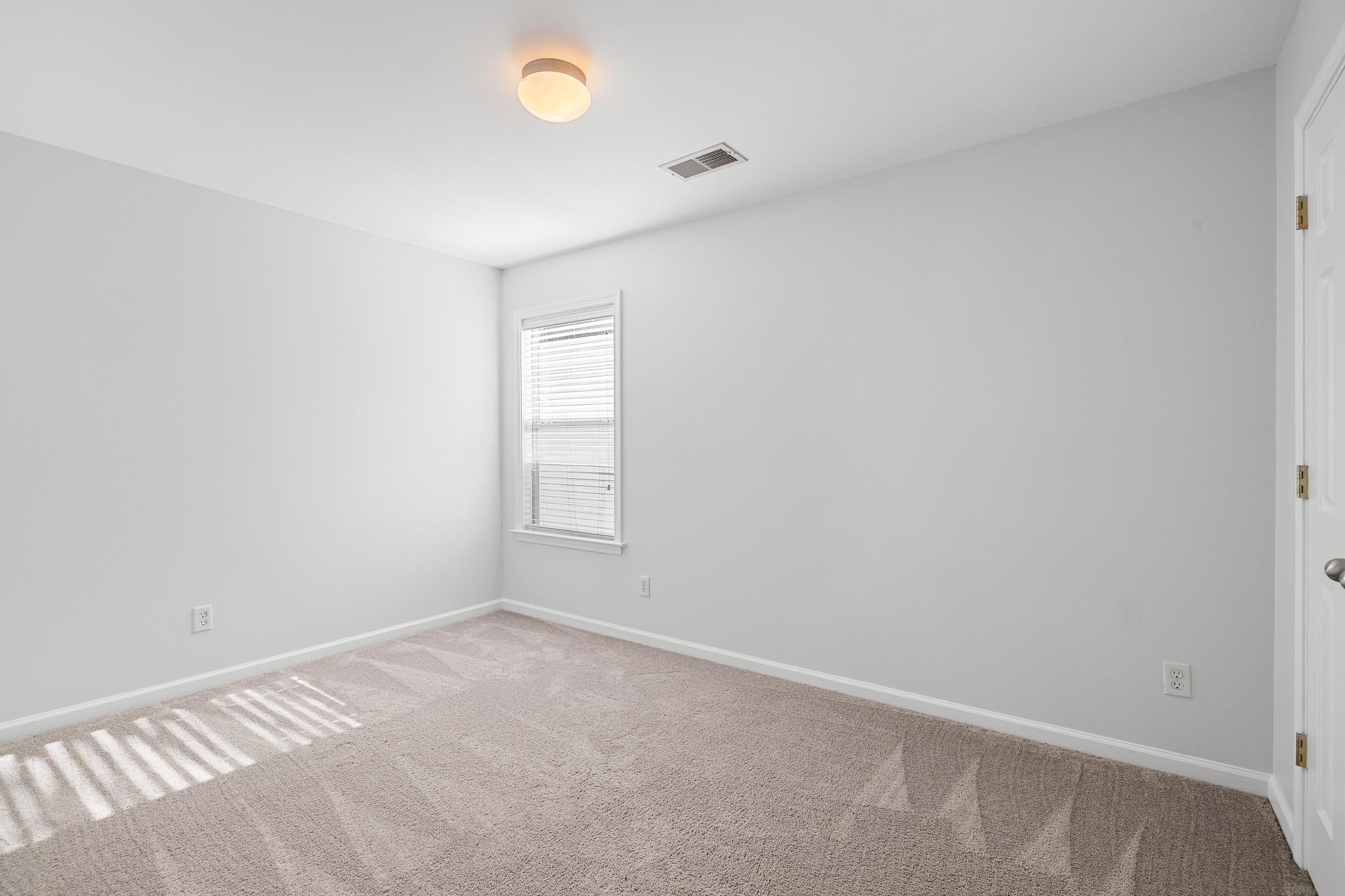 1323 Island Ridge Drive Memphis, TN 38103 - Photo 24 of 29 an empty room with a empty space and a window