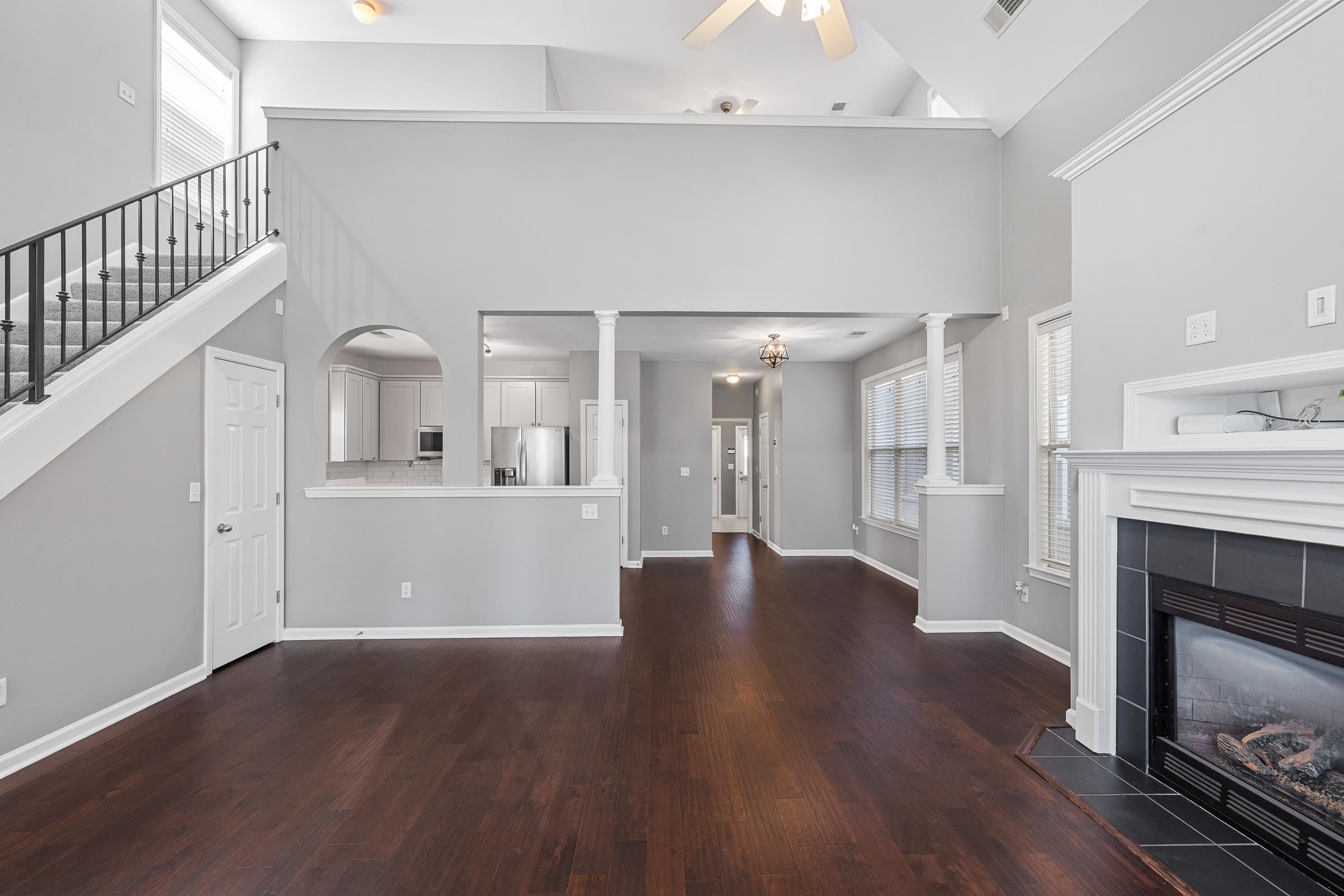 1323 Island Ridge Drive Memphis, TN 38103 - Photo 8 of 29 a view of a hallway with wooden floor and a kitchen