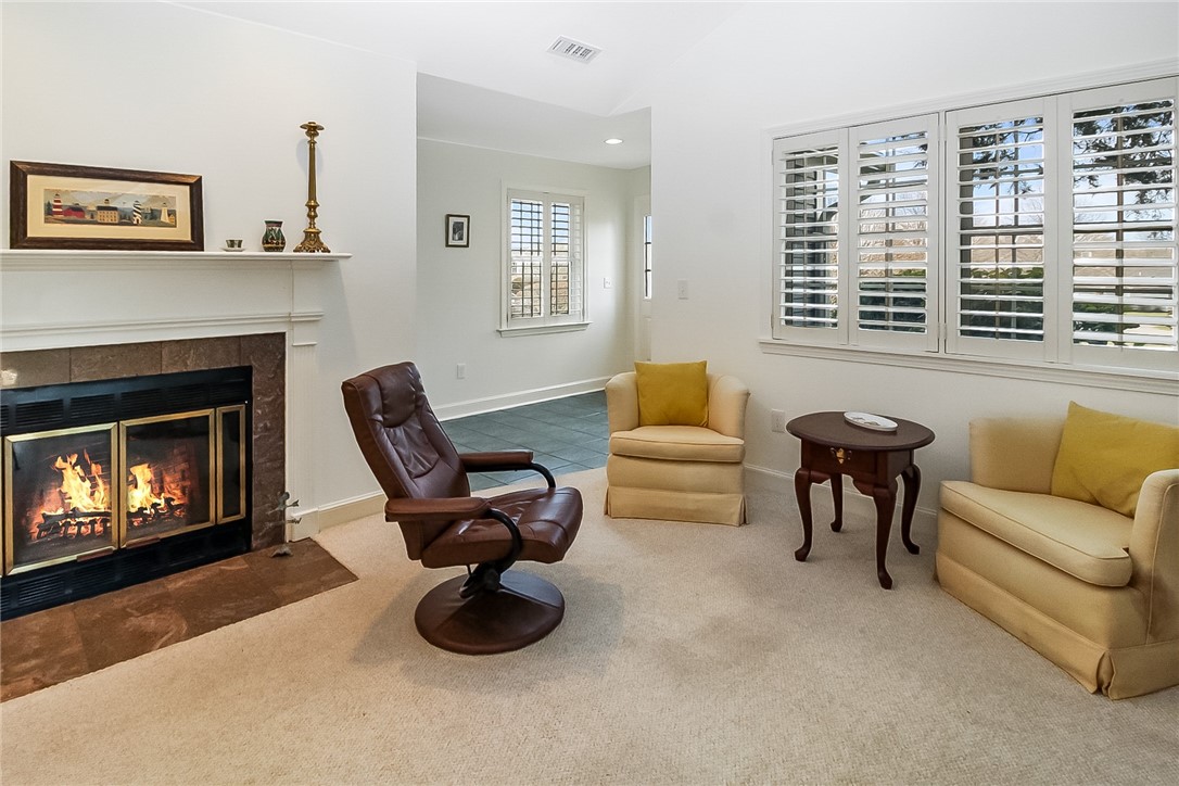318 Corey Lane, Unit 318 Middletown, RI 02842 - Photo 6 of 31 Living Room has Vaulted Ceiling & Wood Burning Fireplace