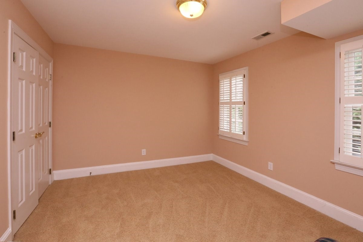 3200 Anderson Drive Raleigh, NC 27609 - Photo 16 of 25 Bedroom features large closet, neutral carpeting and plus multiple windows with plantation shutters. Bedroom