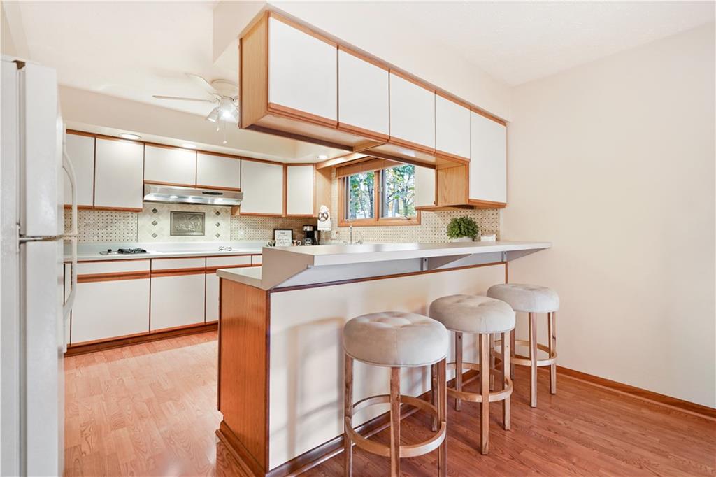 195 Shafer Road Coraopolis, PA 15108 - Photo 2 of 25 Open Kitchen breakfast bar with seating area also allows for easy serving to Dining Area.