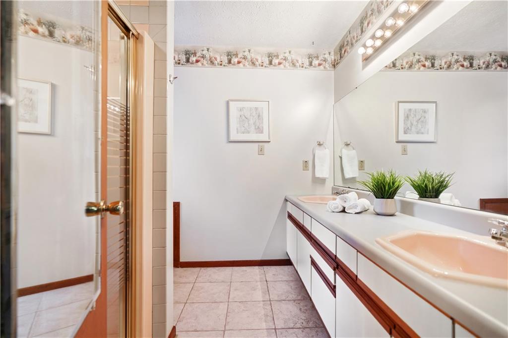 195 Shafer Road Coraopolis, PA 15108 - Photo 11 of 25 Master bathroom includes a double vanity and tile surround shower.