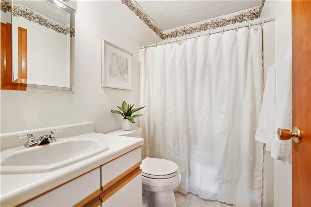 195 Shafer Road Coraopolis, PA 15108 - Photo 14 of 25 Second floor hall bath has a linen closet, fiberglass surround tub/shower and vinyl flooring.
