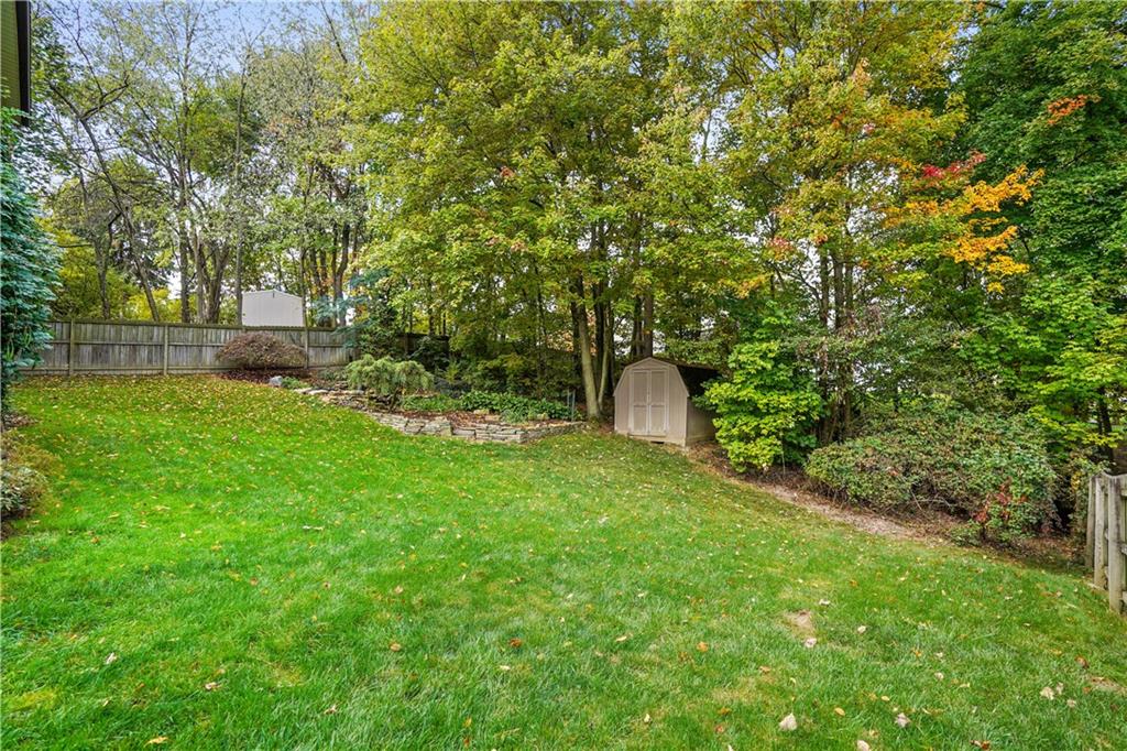 195 Shafer Road Coraopolis, PA 15108 - Photo 22 of 25 Full fenced backyard has a waterfall with pond and shed!