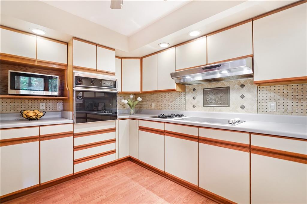 195 Shafer Road Coraopolis, PA 15108 - Photo 4 of 25 Travertine wall tile with a decorative inlay surrounds the spacious Kitchen. Cooks it's your choice, gas or electric cook top both are here.
