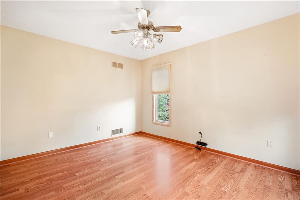195 Shafer Road Coraopolis, PA 15108 - Photo 7 of 25 First floor office has easy maintenance laminate wood style flooring and ceiling fan.