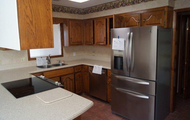505 Ridge Lake Road Crestview, FL 32536 - Photo 4 of 18 a kitchen with stainless steel appliances a refrigerator and a sink
