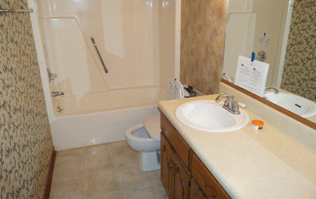505 Ridge Lake Road Crestview, FL 32536 - Photo 9 of 18 a bathroom with a sink and a mirror